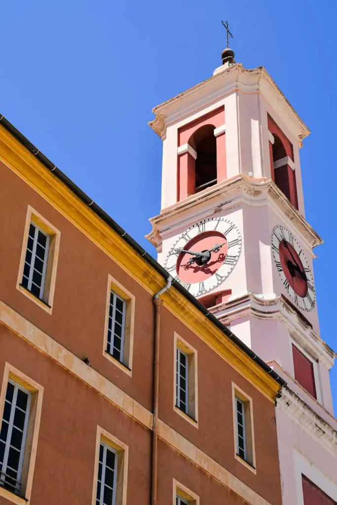 Pastel-hued village and bell tower on the French Riviera, featured in a bespoke itinerary experience