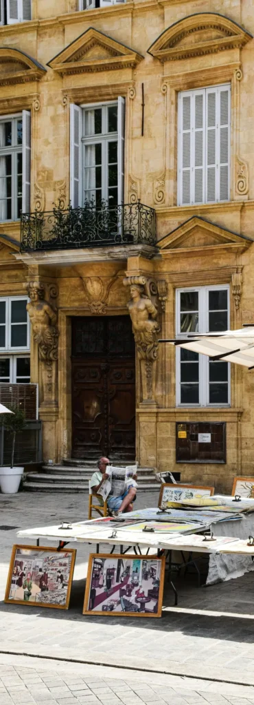 Luxury city breaks in France with outdoor book stalls in a sunlit square of a historic French town