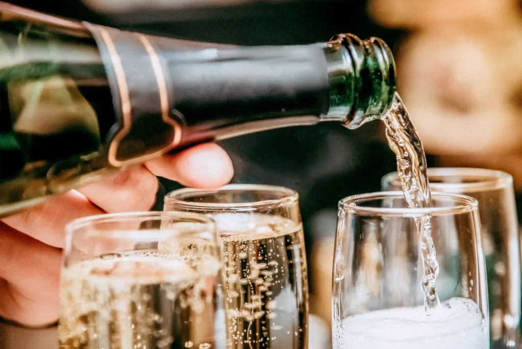 Champagne being poured into a glass, symbolizing celebration and French elegance