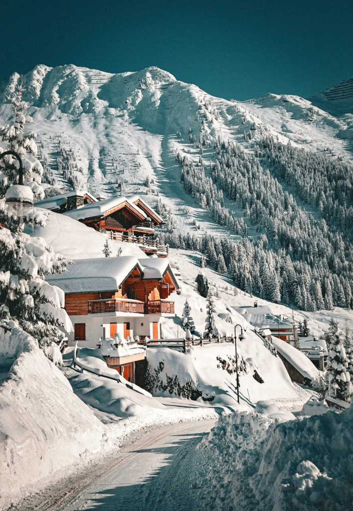 Family skiing in the French Alps near a chalet