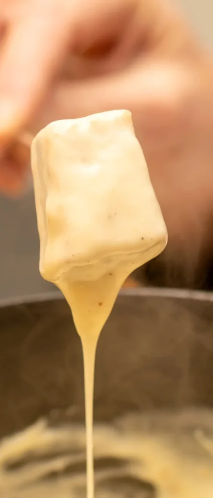Traditional cheese fondue served in a cozy winter ambiance in France