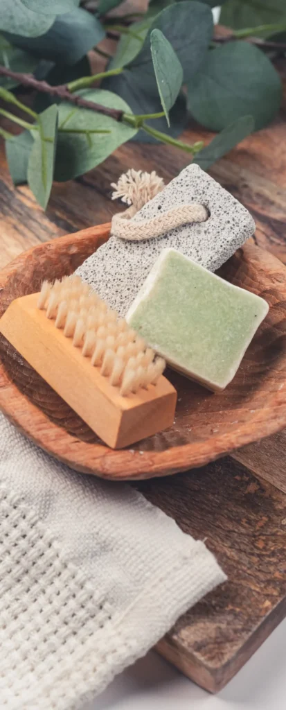 Artisan spa soaps and brushes on a linen towel for a French wellness ritual