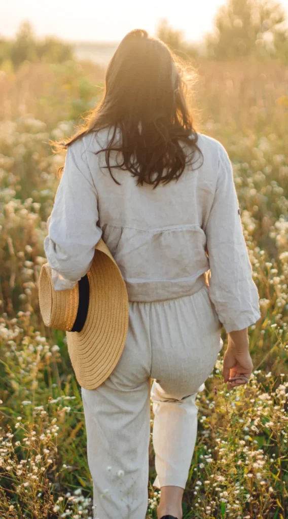Sunlit tall grasses swaying in a peaceful French countryside, evoking the serenity of wellness and adventures in France