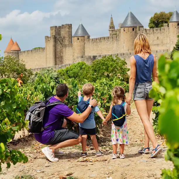 Children exploring a historic French château with a guide