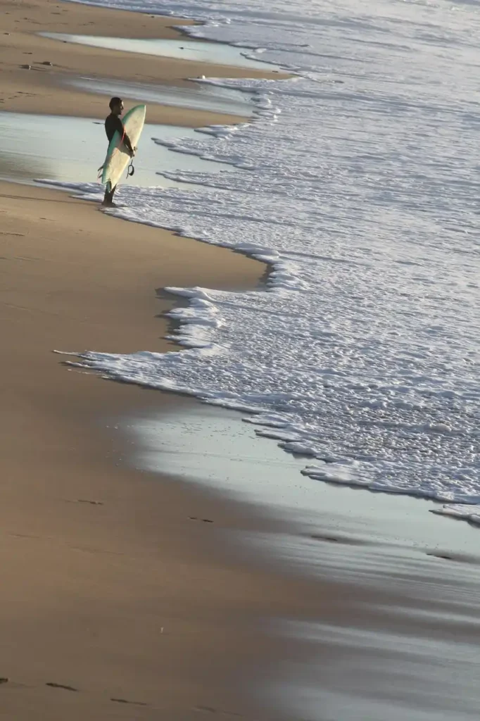 Waves lapping golden sand on a quiet French beach