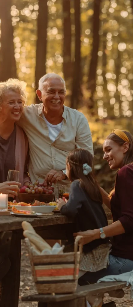 Family enjoying a relaxed gourmet meal in a forest setting in France