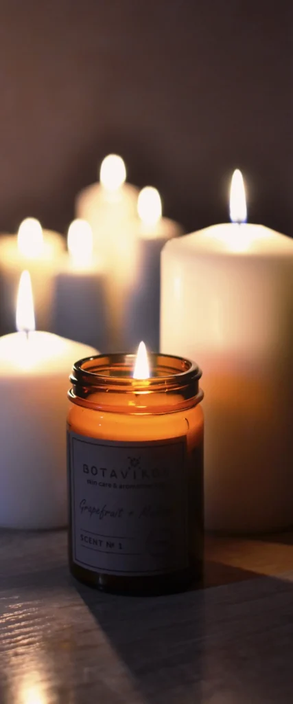 Soft candlelight in a serene spa setting evoking French wellness
