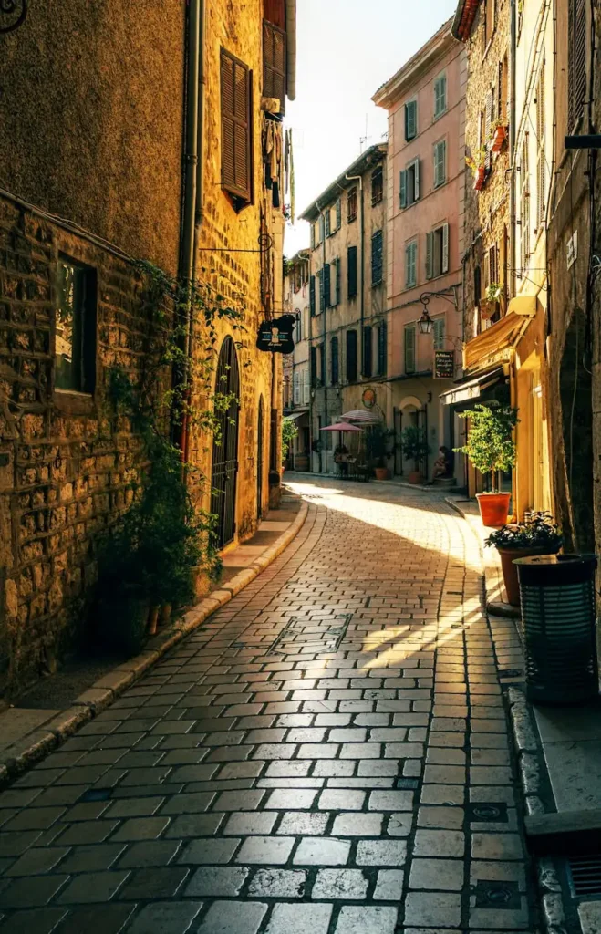 Cobbled alleyway in a historic village at golden hour