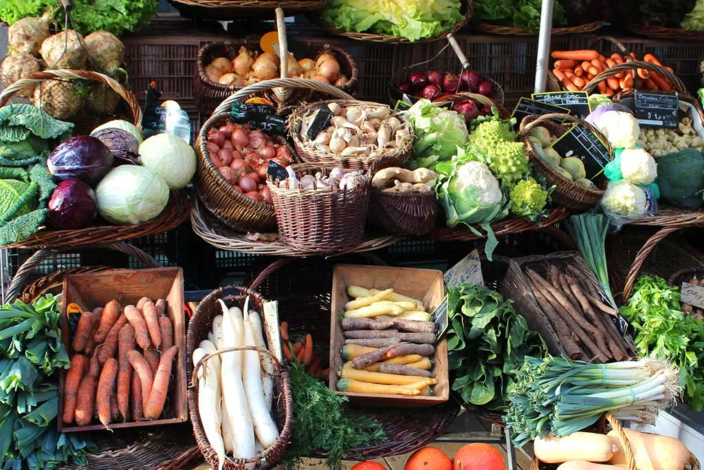 Colorful display of organic vegetables at a French open-air market