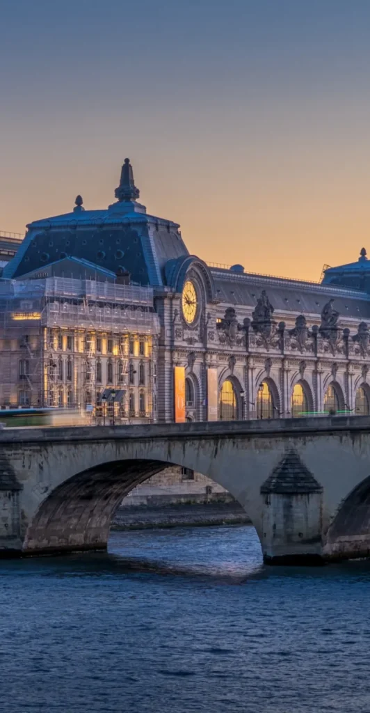Twilight over the Seine River with Parisian monuments and bridge