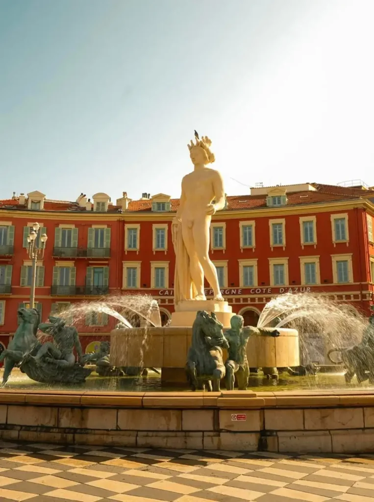 Statue in Place Masséna in Nice, glowing in the late afternoon sun