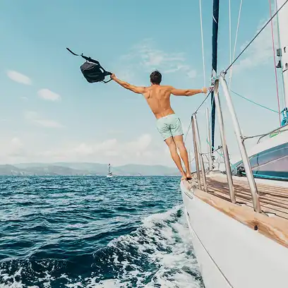 Couple sailing on a private yacht in turquoise sea
