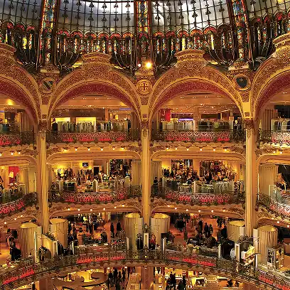 Luxury shopping gallery in Paris with ornate golden interiors