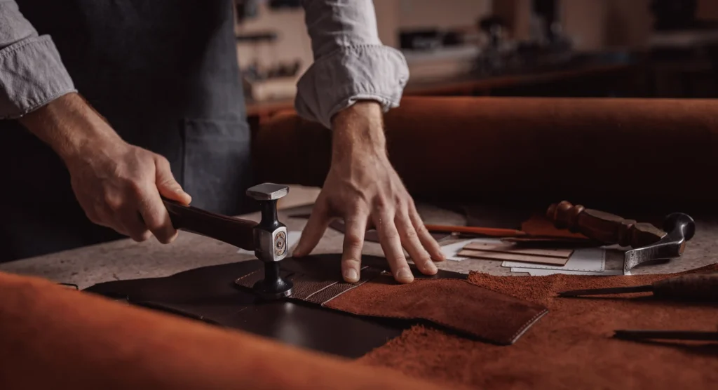 Close-up of a French artisan handcrafting with precision