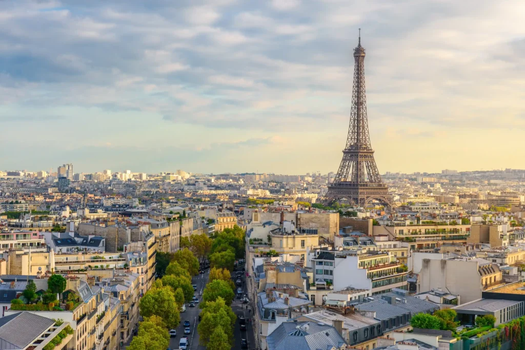 Eiffel Tower surrounded by blooming cherry blossoms in springtime Paris