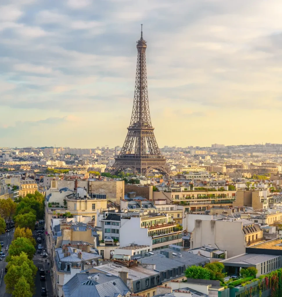 Eiffel Tower surrounded by blooming cherry blossoms in springtime Paris
