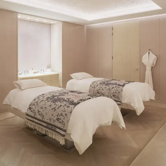 Serene luxury spa suite with plush bedding for honeymoon couples in France