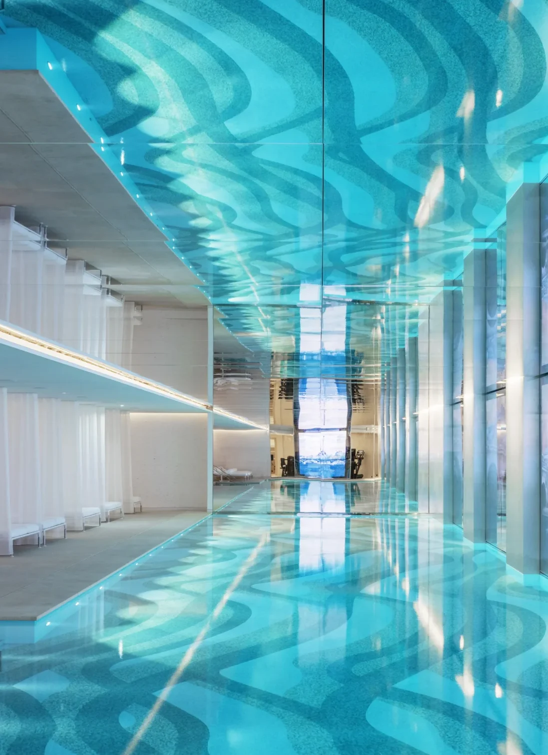 Rooftop infinity pool with turquoise water at luxury Paris hotel