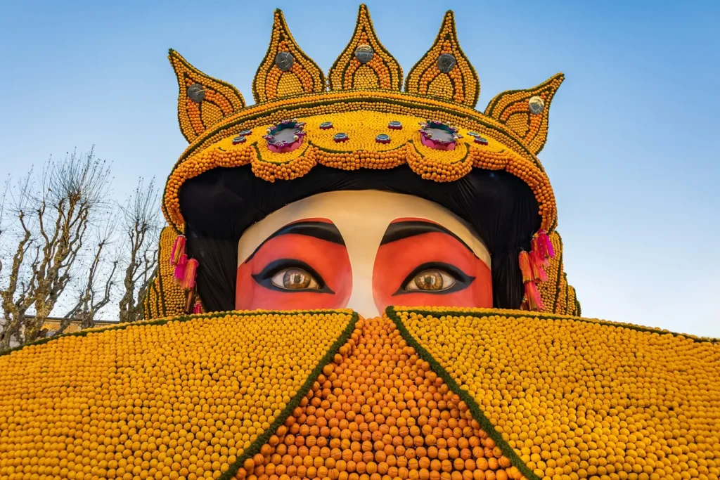 Giant crowned figure made from citrus fruits at Menton Lemon Festival