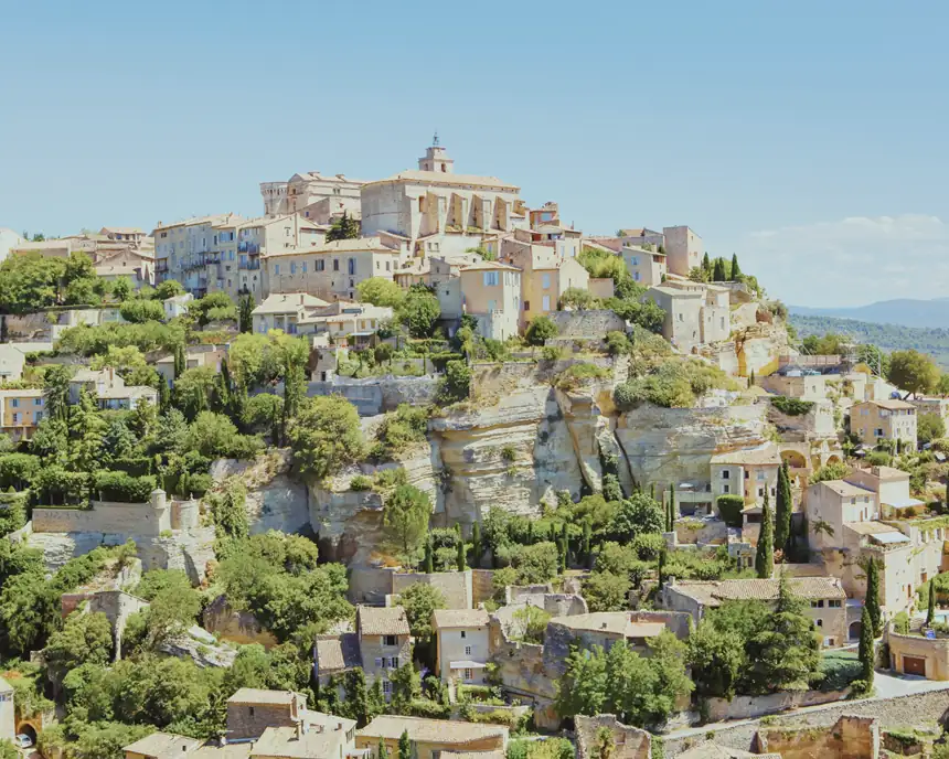 Gordes medieval hilltop village cascading down limestone cliff in Luberon Provence