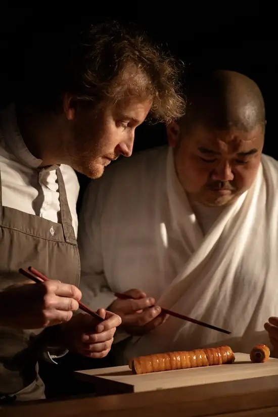 Chefs Maxime Frédéric and Takuya Watanabe preparing a refined dessert at Hakuba in Cheval Blanc Paris.[memory:2]