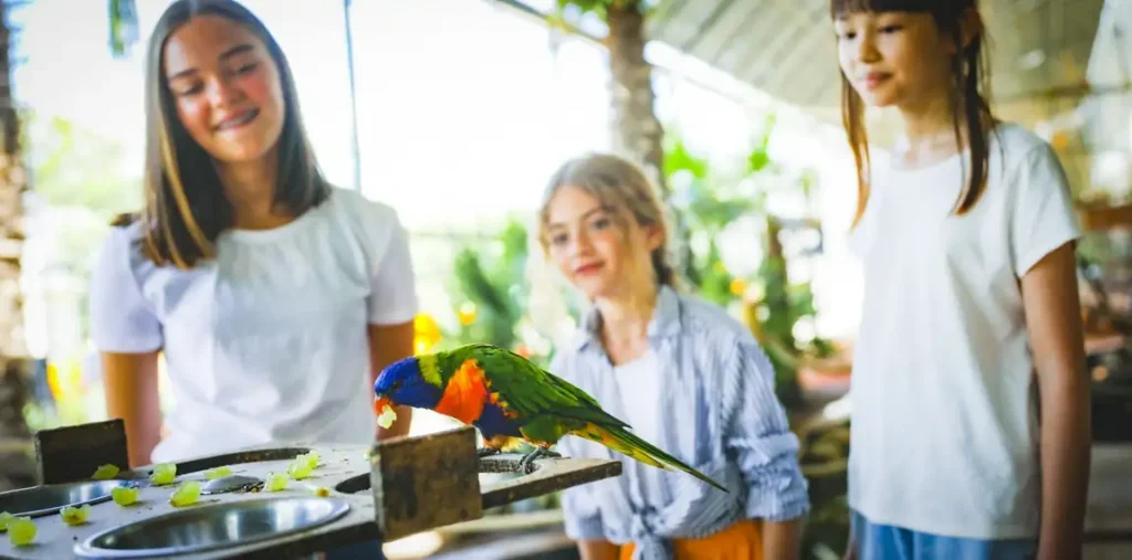 Children taking part in a hands-on cooking workshop in a bright space in Paris.