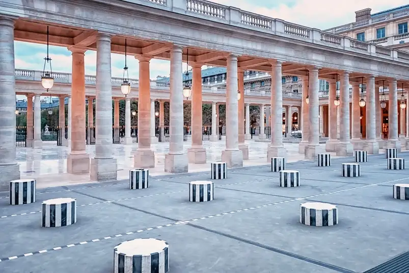 Palais Royal courtyard in Paris featuring the black and white Colonnes de Buren art installation.