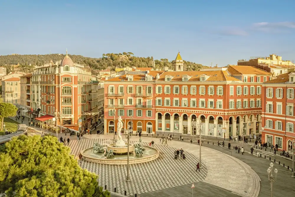 Place Massena square in Nice with colorful façades and tramway
