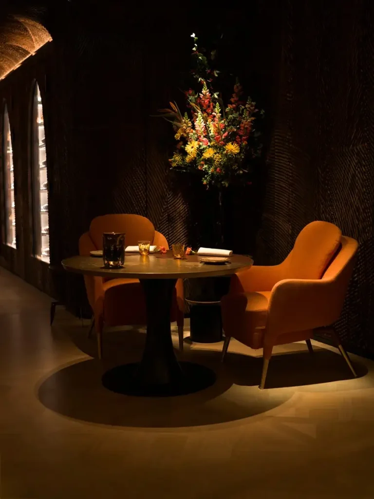 Plénitude fine-dining restaurant room at Cheval Blanc Paris with intimate, candlelit ambiance.[memory:2]