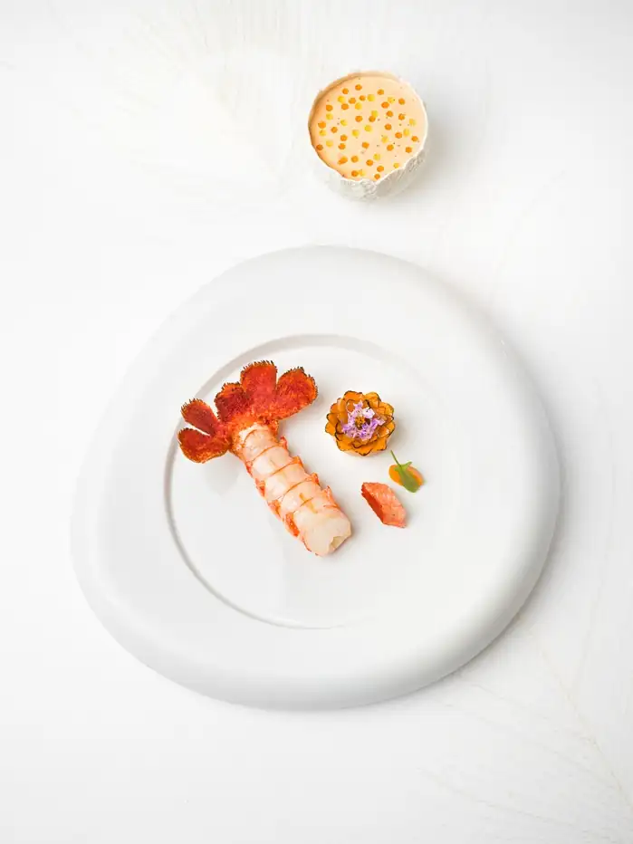 Artfully plated langoustine with squash and rosemary at Plénitude in Paris.[memory:2]