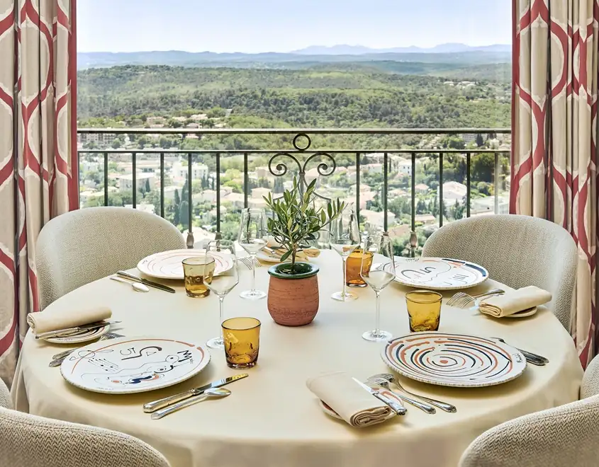 Historic stone village street with lavender and Mediterranean architecture in Provence