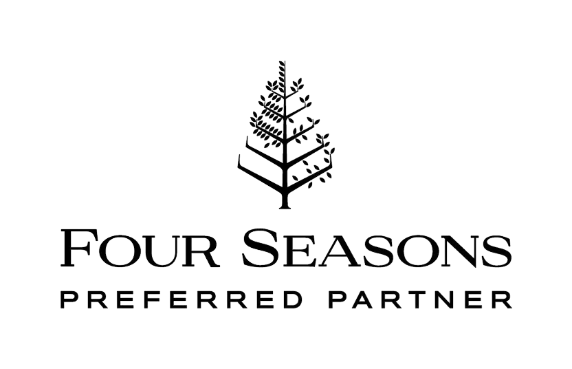 Four Seasons Preferred Partner logo on dark background – luxury hotel brand emblem