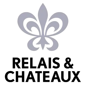 Relais & Châteaux fleur-de-lis logo representing luxury boutique hotels and gourmet dining