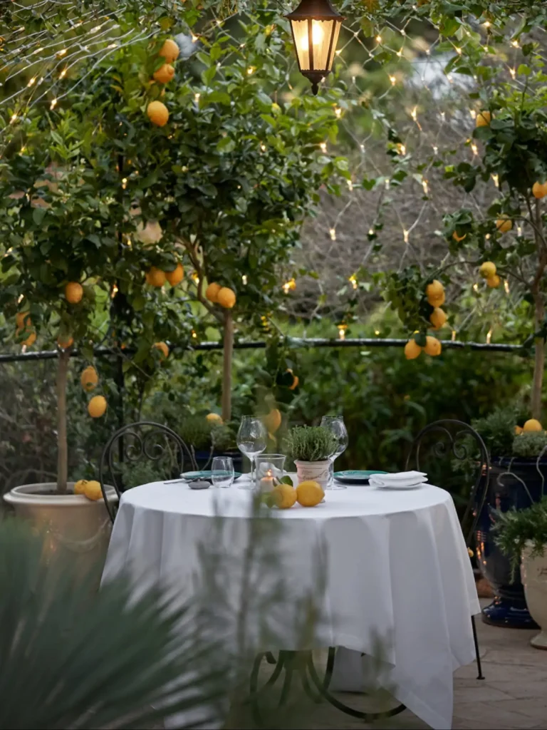 Elegant al fresco dining setup in a lush Mediterranean garden for a private luxury event