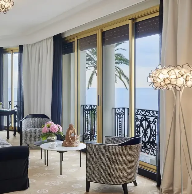 Luxurious living room suite with balcony and Mediterranean view at Hotel Negresco in Nice
