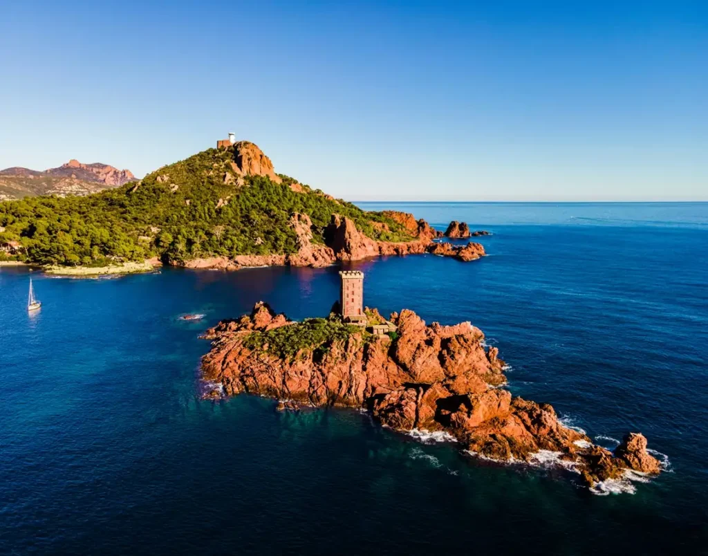 The iconic Ile d'Or island with its medieval-style stone tower off the coast of Saint-Raphaël.