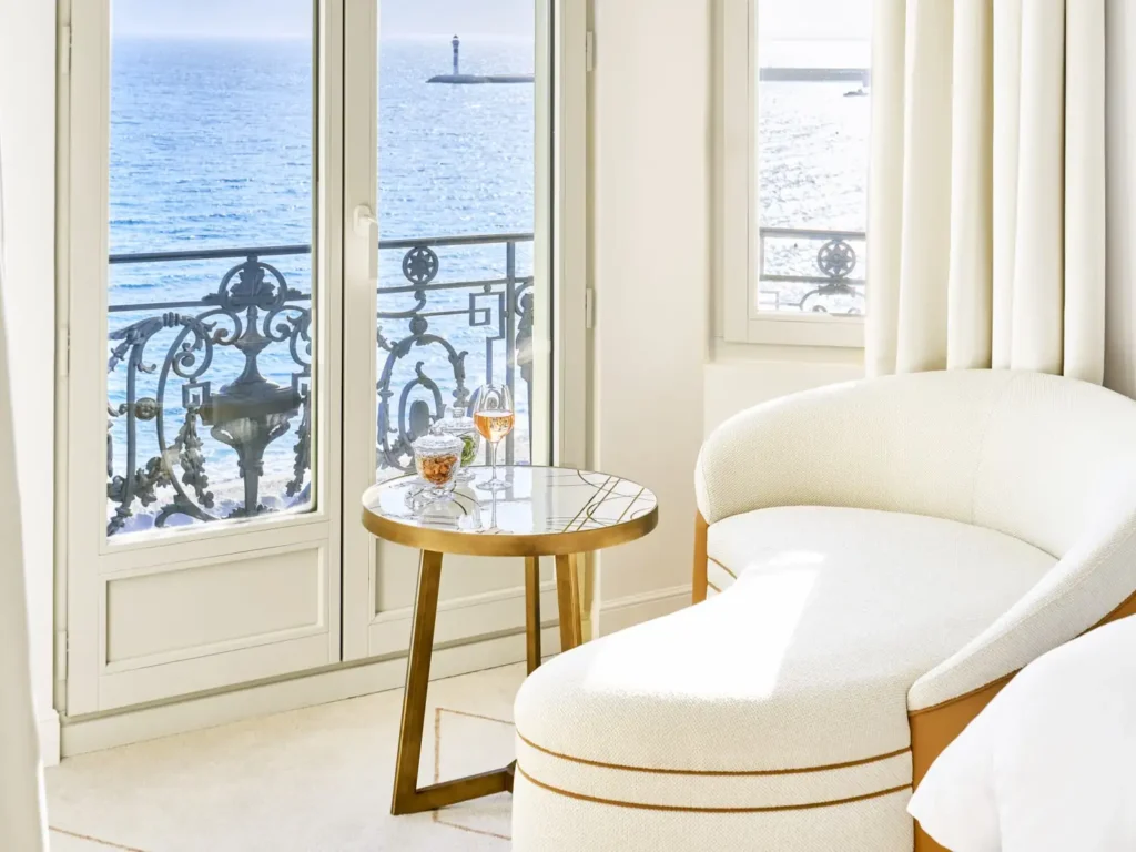 Sophisticated white luxury suite with elegant furnishings at the InterContinental Carlton Cannes