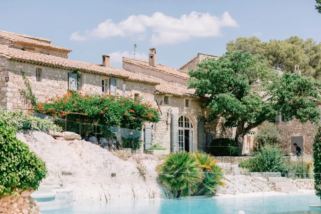 Beautiful Provencal stone estate featuring a private swimming pool, lush gardens, and large shade trees
