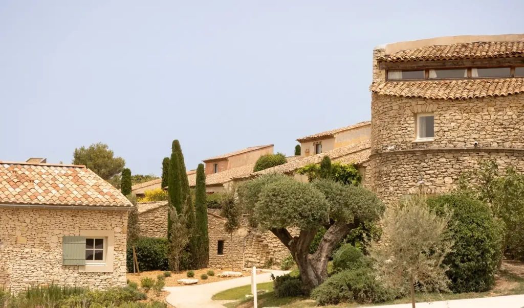 Traditional stone buildings and lush olive trees at a luxury boutique hotel in the heart of the French countryside