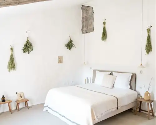Elegant minimalist bedroom suite with soft natural light at a luxury Provence retreat