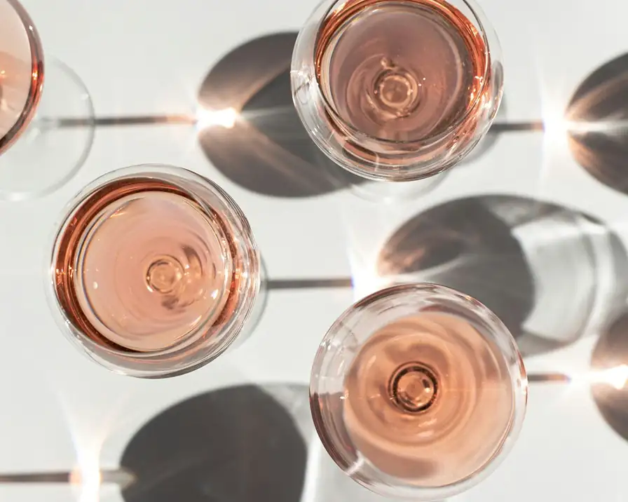 Chilled glasses of Provence rosé wine in golden sunlight